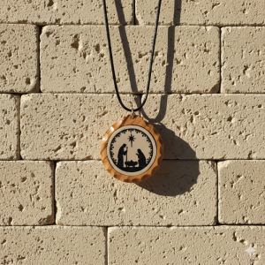 Marble stone pendant with Holy family engraving framed in olive wood